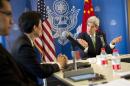 U.S. Secretary of State John Kerry gestures during a discussion with Chinese bloggers in Beijing