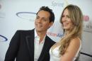 FILE - In this May 20, 2012 file photo, singer Marc Anthony, left, and Shannon De Lima attend the "Sports Spectacular" in Los Angeles, California. The grammy-winning salsa singer has married his Venezuelan model bride. The 46-year-old New York-born singer of Puerto Rican roots tied the knot with 26-year-old De Lima at a Tuesday, Nov. 11, 2014 ceremony at his residence in the exclusive Dominican resort of Casa de Campo. (Photo by Jordan Strauss/Invision/AP, File)