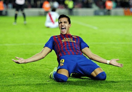 Barcelona's Alexis Sanchez celebrates after scoring