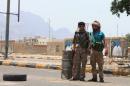 Shiite Huthi fighters set up a checkpoint in the Khor Maksar neighbourhood of Yemen's southern coastal city of Aden, on April 2, 2015