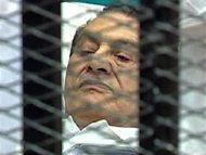 Former Egyptian President Hosni Mubarak is seen in the courtroom for his trial at the Police Academy in Cairo, August 3, 2011. REUTERS/Egypt TV via Reuters TV