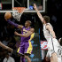 Los Angeles Lakers' Kobe Bryant, left, puts up a shot underneath the basket while Brooklyn Nets' Brook Lopez defends during the first half of the NBA basketball game at the Barclays Center Tuesday, Feb. 5, 2013 in New York. (AP Photo/Seth Wenig)