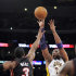 Los Angeles Lakers guard Kobe Bryant, right, shoots over Miami Heat guard Dwyane Wade (3) during the first half of their NBA basketball game, Sunday, March 4, 2012, in Los Angeles. (AP Photo/Mark J. Terrill)