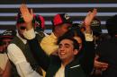 Bilawal Bhutto Zardari (C), chairman of Pakistan Peoples Party (PPP), waves to supporters as he arrives at a rally in Karachi on October 18, 2014