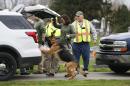 In a Wednesday, March 23, 2016 photo, a search and rescue dog is prepared to search the area near a house where a baby disappeared in Spencer, Ind. Shaylyn Ammerman was reported missing from her crib by her grandmother Wednesday morning. The search continued Thursday. (Jeremy Hogan/Bloomington Herald-Times via AP) (Jeremy Hogan/(/The Herald-Times via AP) MANDATORY CREDIT