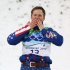 Jeret Peterson of the US celebrates winning the silver medal in the Freestyle skiing aerials at the 2010 Winter Olympics