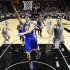 Golden State Warriors' Klay Thompson (11) scores as San Antonio Spurs' Danny Green (4) defends during the first half of Game 2 in their Western Conference semifinal NBA basketball playoff series, Wednesday, May 8, 2013, in San Antonio. (AP Photo/Eric Gay)