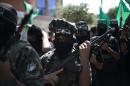 Palestinian Hamas militants take part in an anti-Israeli protest after the weekly Friday prayers in the southern Gaza Strip town of Khan Yunis on September 18, 2015