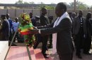 Mali's interim President Traore lays a wreath in front of a monument on Martyrs' Day in Bamako
