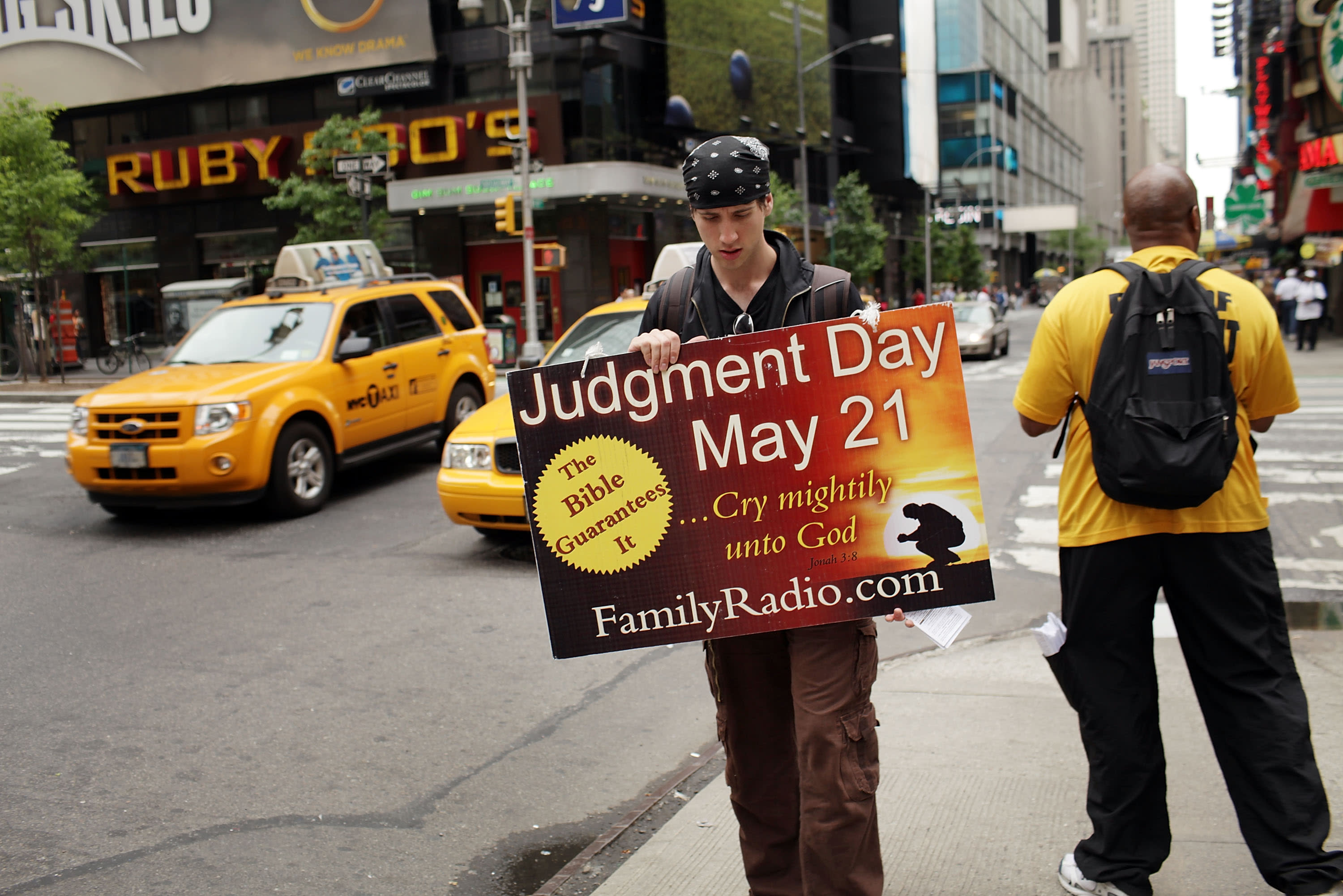 NEW YORK, NY - MAY 13:  Participants in a movement that is proselytizing that the world will end this May 21, Judgment Day, gather on a street corner on May 13, 2011 in New York City. The Christian based movement, which claims thousands of supporters around the country and world, was founded by the Oakland, Calif.-based Harold Camping. Camping is president of Family Stations Inc., a religious broadcasting network that promotes the belief that May 21, 2011 is Judgment Day. Camping claims to have come to this date by a deep and complex study of religious texts. Camping was wrong on his prior end-of-the-world prediction in 1994.  (Photo by Spencer Platt/Getty Images)