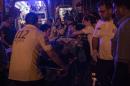 First aid officers carry an injured man to hospital August 20, 2016 in Gaziantep following a late night militant attack on a wedding party in southeastern Turkey