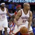 Oklahoma City Thunder guard Derek Fisher (37) drives around Los Angeles Clippers guard Eric Bledsoe, center, in the second quarter of an NBA basketball game in Oklahoma City, Wednesday, March 21, 2012. (AP Photo/Sue Ogrocki)