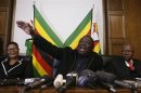 Zimbabwe Prime Minister and leader of the opposition Movement for Democratic Change (MDC) Morgan Tsvangirai gestures during a news conference in Harare