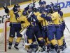 The Nashville Predators celebrate after defeating the Detroit Red Wings 2-1 in Game 5 of a first-round NHL hockey playoff series on Friday, April 20, 2012, in Nashville, Tenn. The Predators won the series 4-1. (AP Photo/Mark Humphrey)