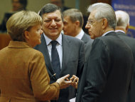 <p>               German Chancellor Angela Merkel, left, speaks with European Commission President Jose Manuel Barroso, center, and Italian Prime Minister Mario Monti during a round table meeting at an EU Summit in Brussels on Friday, March 2, 2012. The leaders of 25 European states have signed a new treaty designed to prevent the 17 euro countries from running up huge debts in order to prevent a repeat of the current crisis afflicting the single currency zone. (AP Photo/Remy de la Mauviniere)