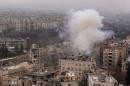 Smoke rises near Bustan al-Qasr crossing point in a government controlled area, during clashes with rebels in Aleppo