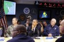 President Barack Obama, center, attends a briefing with Federal Emergency Management Agency administrator Craig Fugate, right, at the National Response Coordination Center at FEMA Headquarters in Washington, on Sunday, Oct. 28, 2012. (AP Photo/Jacquelyn Martin)