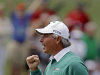Fred Couples pumps his fist after a birdie on the ninth hole during the second round of the Masters golf tournament Friday, April 6, 2012, in Augusta, Ga. (AP Photo/Charlie Riedel)