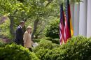 President Barack Obama and German Chancellor Angela Merkel walk to the Oval Office of the White House in Washington, Friday, May 1, 2014, after their joint news conference in the Rose Garden. Obama and Merkel are putting on a display of trans-Atlantic unity against an assertive Russia, even as sanctions imposed by Western allies seem to be doing little to change Russian President Vladimir Putin's reasoning on Ukraine. (AP Photo/Carolyn Kaster)
