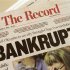 A local newspaper headline announces bankruptcy in Stockton, California