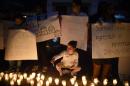 Guatemalans protest against the murder of a Guatemalan teen outside the embassy of Belize in Guatemala City on April 25, 2016