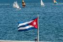 A Cuban national flag flutters as participants of the Havana Challenge regatta compete in Havana on May 19, 2015