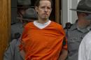 Eric Frein, charged with murder of Pennsylvania State Trooper Cpl. Byron Dickson and critically wounding Trooper Alex Douglass Sept. 10, is taken to prison after a preliminary hearing in Pike County Courthouse on Friday, Oct. 31, 2014 in Milford, Pa. (AP Photo/The Scranton Times-Tribune, Michael J. Mullen)