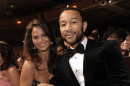 File- This Feb. 26, 2010 file photo shows John Legend, right, and Christine Teigen at the 41st NAACP Image Awards in Los Angeles. Legend is officially off the market. The R&B crooner's representative said Legend married Teigen on Saturday Sept. 14, 2013 at the Villa Pizzo in Lake Como, Italy. Legend, 34, and Teigen, 27, were engaged in 2011. (AP Photo/Chris Pizzello, File)