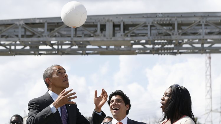 U.S. President Obama heads a soccer ball at Ubungo Power Plant in Dar es Salaam
