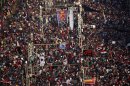 A general view of protesters opposing Egyptian PresidentMursi waving Egyptian flags and shouting slogans against him and members of the Muslim Brotherhood, during a protest in front of El-Thadiya presidential palace in Cairo