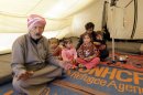 A Syrian man sits in his tent at the Zaatari refugee camp, near the Syrian border with Jordan in Mafraq on March 7, 2013