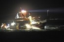 Handout of Dutch fishing boat OUDDORP 6 and a Dutch navy ship during rescue efforts after a collision between the Baltic Ace and the Corvus J in the North Sea
