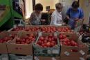 Women choose Dutch tomatoes at a supermarket in downtown Moscow on Thursday.