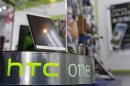 An HTC One smartphone is displayed in a mobile phone shop in Taipei April 8, 2013.