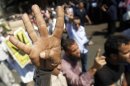 Supporters of Muslim Brotherhood and ousted Egyptian President Mursi shout slogans in Cairo