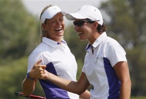 Pettersen and Ciganda of Team Europe celebrate winning the sixth hole over Team USA during the Friday afternoon four-ball matches at the Solheim Cup in Parker