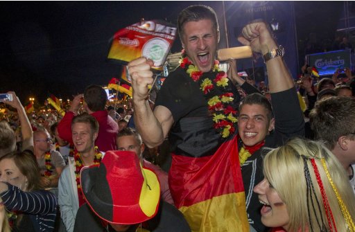 Germany supporters celebrate after Germany beat Portugal at Fan Mile in Berlin