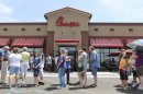 FILE - In a Wednesday. Aug. 1, 2012 file photo, customers stand in line for a Chick-fil-a meal at the chain's restaurant in Wichita, Kan. The crowd was buying meals to show their support for the company that's currently embroiled in a controversy over same-sex marriage. On this and so many other issues this election year, it seems harder to find that middle-ground gray when our debates seem so very black or white. (AP Photo/The Wichita Eagle, Travis Heying, File) LCOAL TV OUT; MAGS OUT; LOCAL RADIO OUT; LOCAL INTERNET OUT