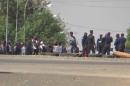 A still image from video that shows soldiers standing at a checkpoint in Bouake, Ivory Coast