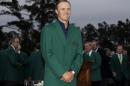 Jordan Spieth poses with his green jacket after winning the Masters golf tournament Sunday, April 12, 2015, in Augusta, Ga. (AP Photo/Matt Slocum)
