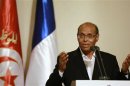 Tunisia's President Moncef Marzouki hold a joint news conference with France's President Francois Hollande in Tunis
