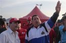 Venezuelan President Hugo Chavez gestures during a visit to an industrial complex in the state of Anzoategui