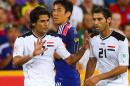 Iraq midfielder Alaa Abdulzehra (L) and Saad Abdulameer Aldobjahawe pictured during their Asian Cup match against Japan in Brisbane on January 16, 2015