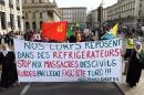 Members of the Kurdish community in Bordeaux walk behind a banner reading "Our bodies lie in refrigerators! Stop the massacre of Kurdish civilians by the Turkish fascist state!" during a demonstration on October 10, 2015
