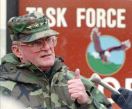 FILE - In this Friday, Feb. 9, 1996 file picture, Chairman of the U.S. Joint Chiefs of Staff Gen. John Shalikashvili talks with reporters at the Tuzla airbase, the U.S. military headquarters, in northern Bosnia. Retired Army Gen. John Shalikashvili, the first foreign-born chairman of the Joint Chiefs of Staff, who counseled President Bill Clinton on the use of troops in Bosnia and other trouble spots, has died, according to a Saturday, July 23, 2011 statement from the White House. He was 75. (AP Photo/Rick Bowmer)