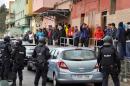 Policemen take part in an operation against a jihadist cell in the Spanish city of Melilla on March 14, 2014