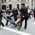 Police carry away a participant in a march organized by Occupy Wall Street in New York on Saturday Sept. 24, 2011.  Marchers represented various political and economic causes. (AP Photo/Tina Fineberg)