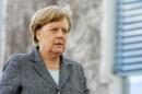 German Chancellor Merkel walks at the Chancellery in Berlin