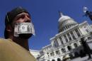 A federal employee protests against the current government shutdown at the U.S. Capitol in Washington