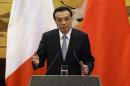 Chinese Premier Li speaks during a news conference with French PM Ayrault in Beijing